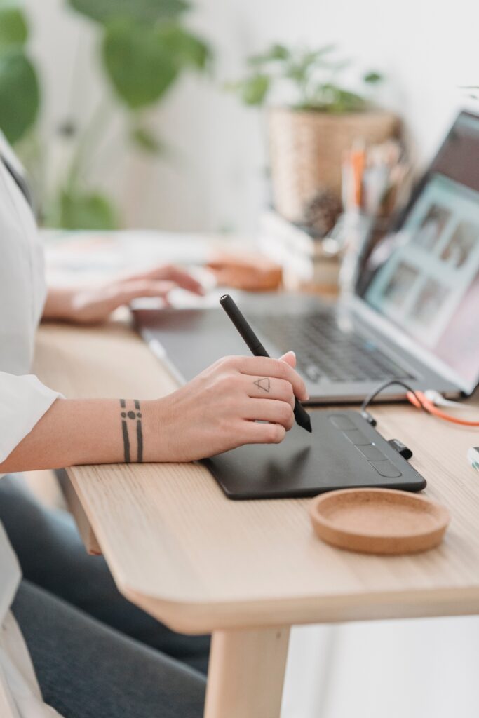 Top roles for remote staffing - Designer working on sketch pad.