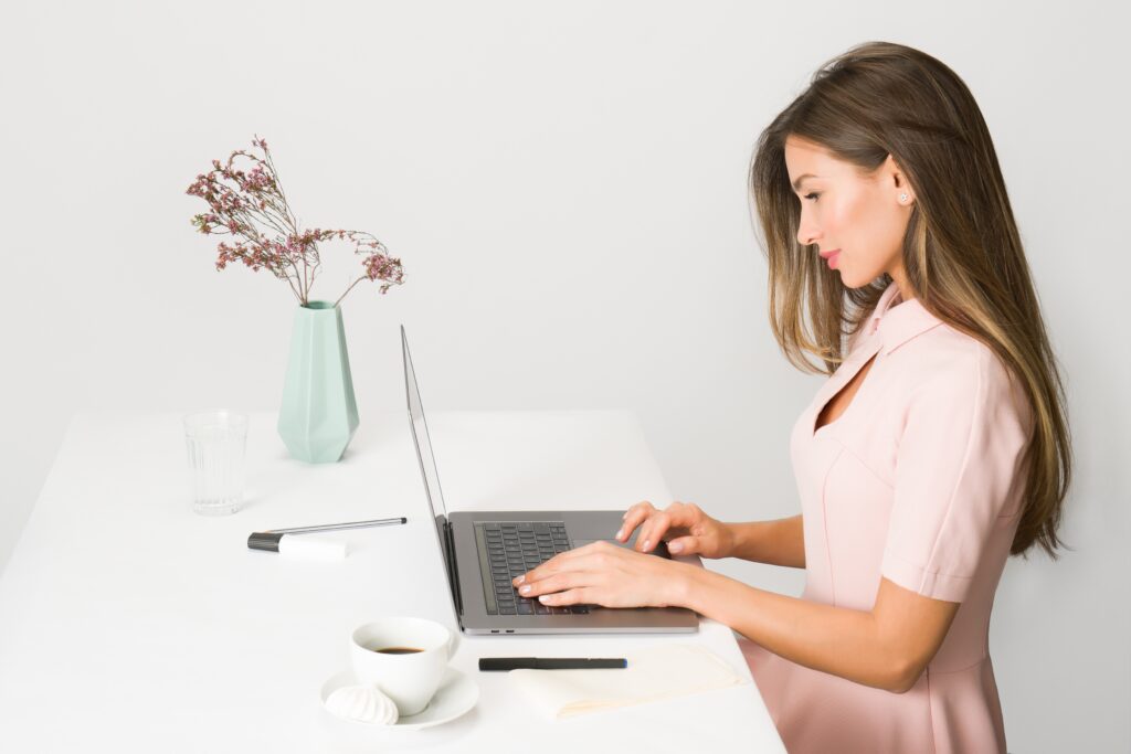 Woman working on her laptop.