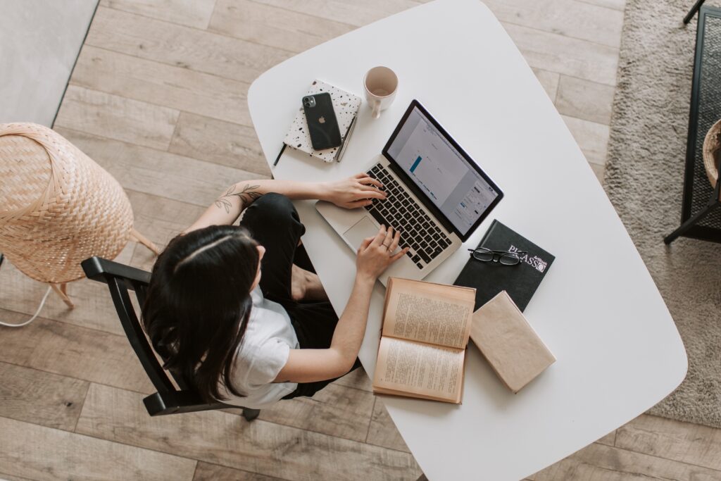 Woman on laptop from above.