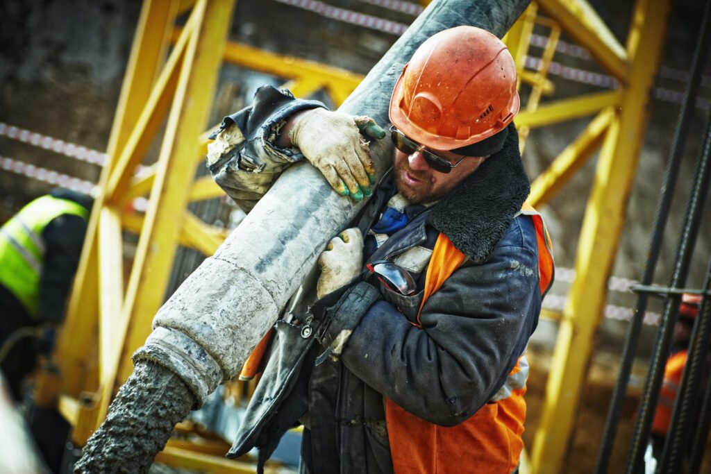 Man carrying building component.